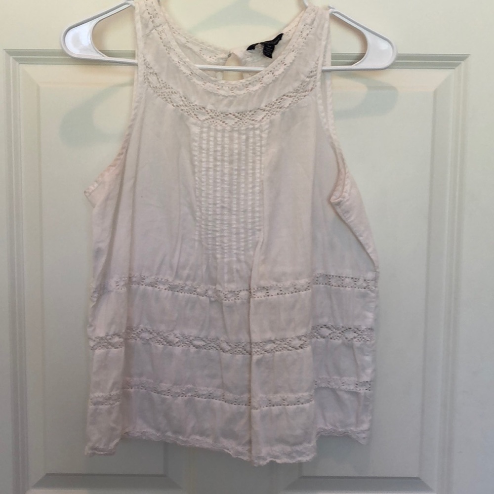 White sleeveless top